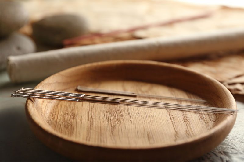 A blue and green abstract geometric pattern with sharp diagonal divisions.